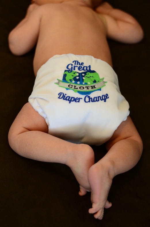 Baby mit Aufschrift 'The Great Diaper Change' auf der Windel